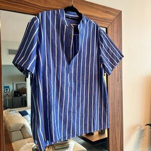 Stripped blue and white shirt. Short sleeve